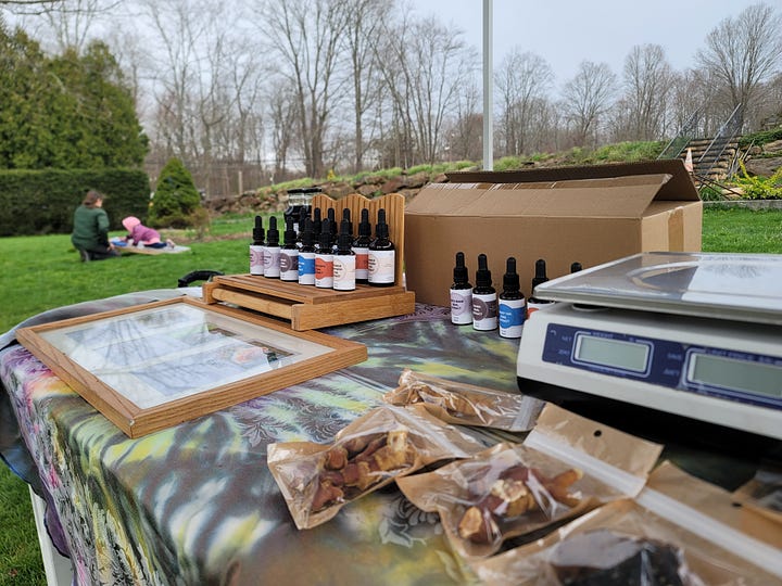 Pictures of our table and products at a farmers market 