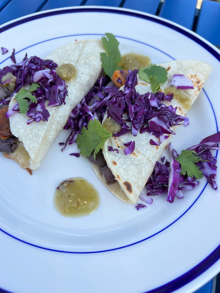 taco ingredients and tacos on a plate