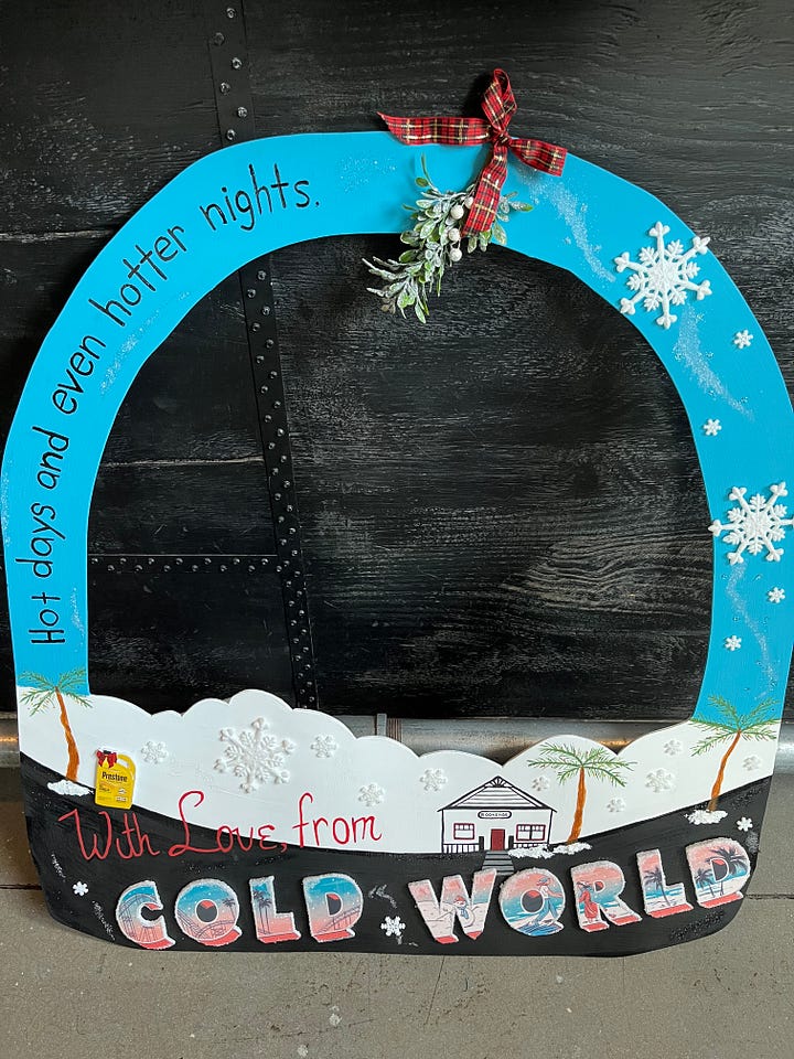 Left: the plate of cookies, tree, coolant cutout, penguins, and book cover in front of a pirate flag and a bunch of brewery stuff; Right: the wooden cutout snow globe for photo ops!