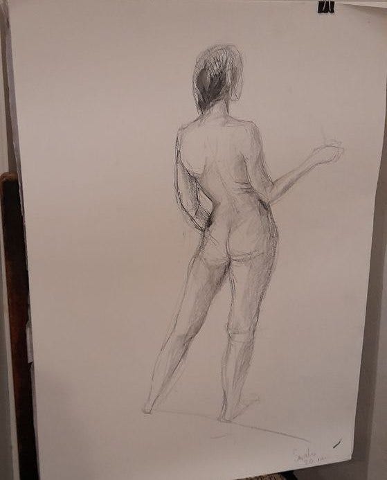 Female life model in poses with props