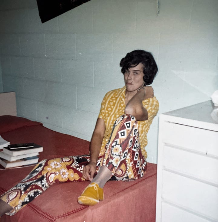 A woman in flowered pants and yellow shit sitting on an orange bedspread and the same woman lying on the floor on her side in blue pajamas