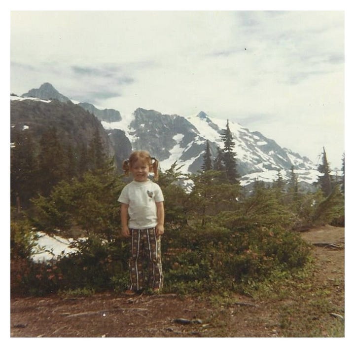 Two photographs of the mountains at Artist Point, WA. One taken on a film camera with a small girl in the 1970s and one taken on an iPhone of mountains only in the 2020s.
