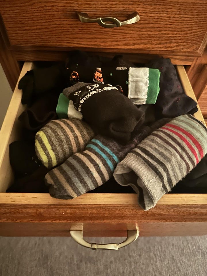 The picture on the left side shows an overflowing sock drawer. On the right, the drawer has a more comfortable amount allowing the owner to maneuver it more easily and close the drawer without a struggle.