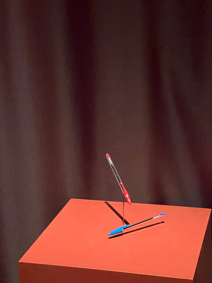 BIC Pens on a pedestal, knotted white chair