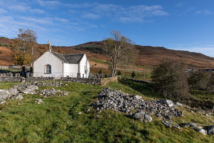 Croick Church within its walled churchyard.