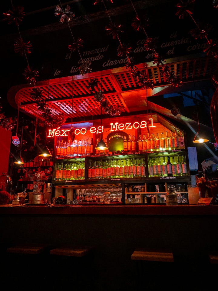 "Mexico es Mezcal" sign at a bar. Center of an agave plant. Photos: Marlon Michelle Corado, Justin Heap via Unsplash.
