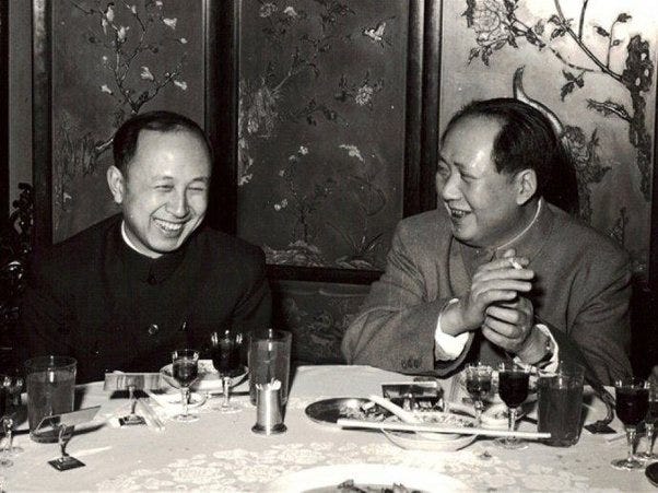 Qian Xuesen with four generations of leaders of the People's Republic of China, in chronological order: Mao Zedong, Deng Xiaoping, Jiang Zemin, and Hu Jintao.