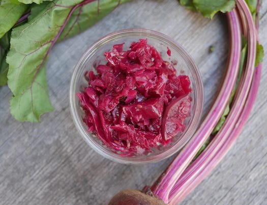 Photo on left has cut red cabbage and other ingredients on cutting board. On the left the finished kraut.