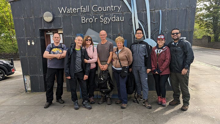 waterfalls and hikers in the brecon beacons with wales outdoors