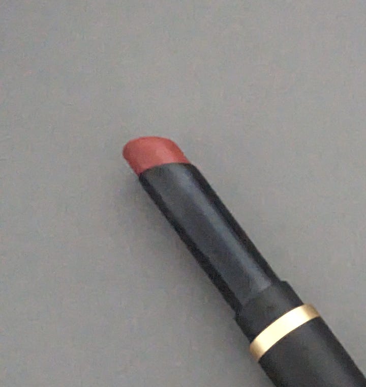 MAC Cosmetics Powder Kiss Slim stick in Nice Spice a pinky red shade