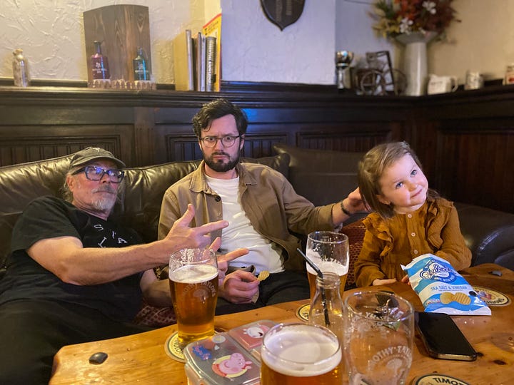 Family with a young girl in a pub in the UK