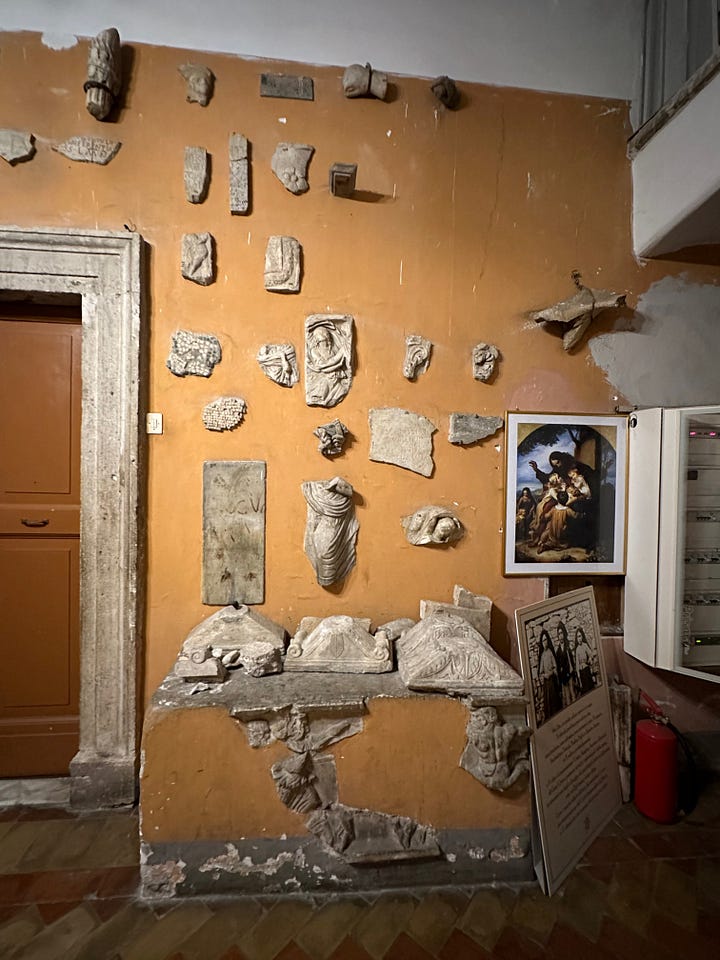 Inside the sacristy of San Pancrazio. 1, pieces of name plates from the catacombs. 2, sculptural fragments. 3, more sculptural fragments. 4, Le Bombe de Napoleon