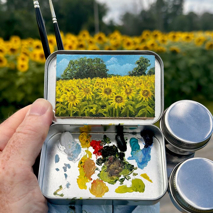 A series of mini paintings in metal mint tins.