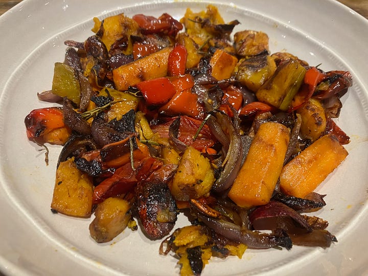 Roast pumpkin, cherry tomatoes, carrots, red pepper, red onion, and rosemary.