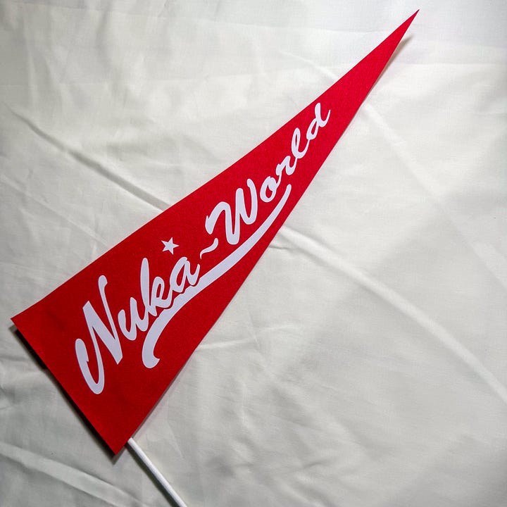 Triangle red flag on a white stick with white text saying Nuka World
