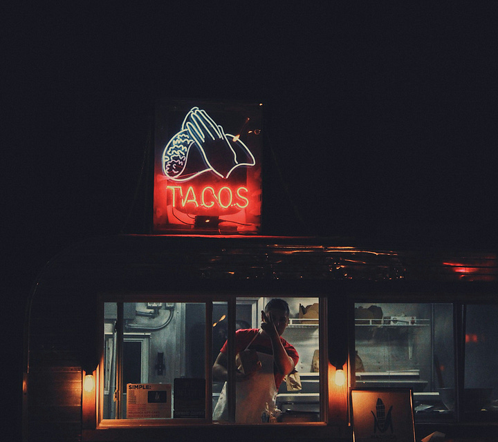 Taco sign with Japanese writing on it, Taco stand at night in Milwaukee, Photos by Brandon Griggs, TJ Dragotta Unsplash