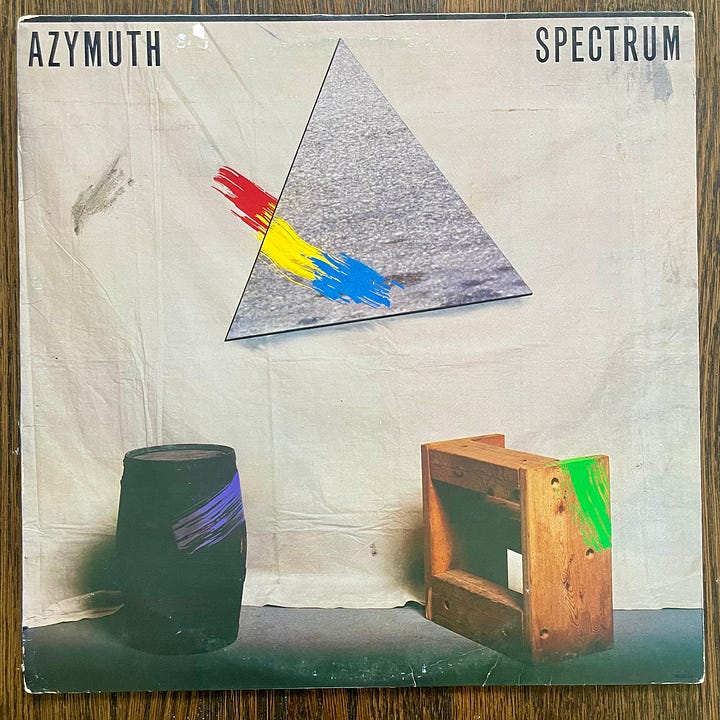 pictures of vinyl records of The Strokes' First Impressions of Earth with Urban Outfitters hype sticker and Azymuth's Spectrum