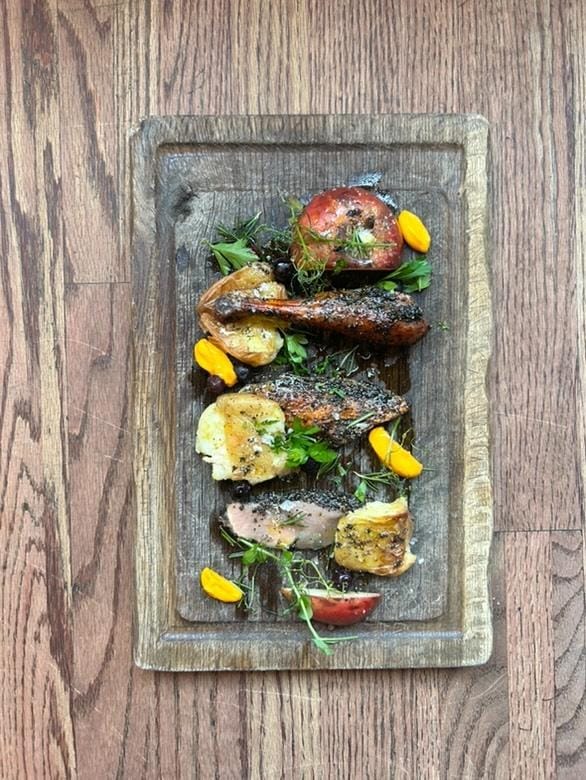 Two images of indigenous food cooked by celebrity chef Shane Chartrand, set out on wooden boards. 