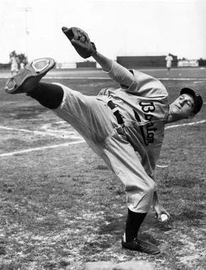 Warren Spahn and Juan Marichal with their high-kick deliveries.