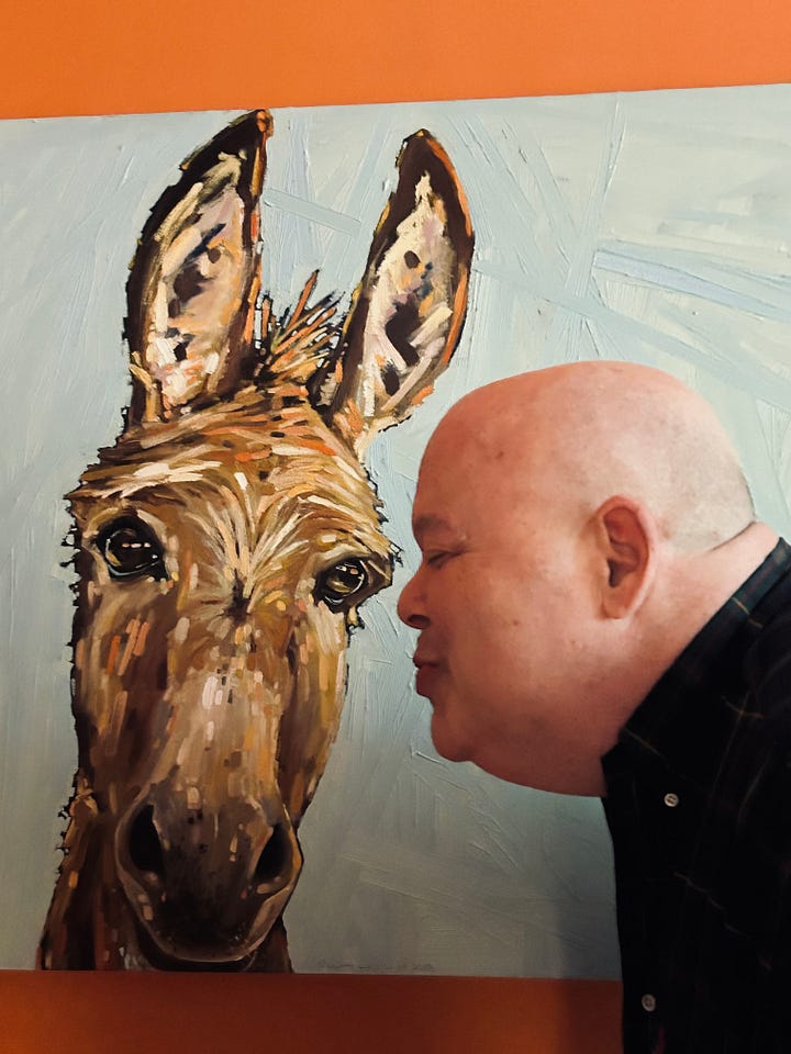 Jim's ear being nibbled by a donkey (in a painting) Kirby kissing a donkey (in a painting).