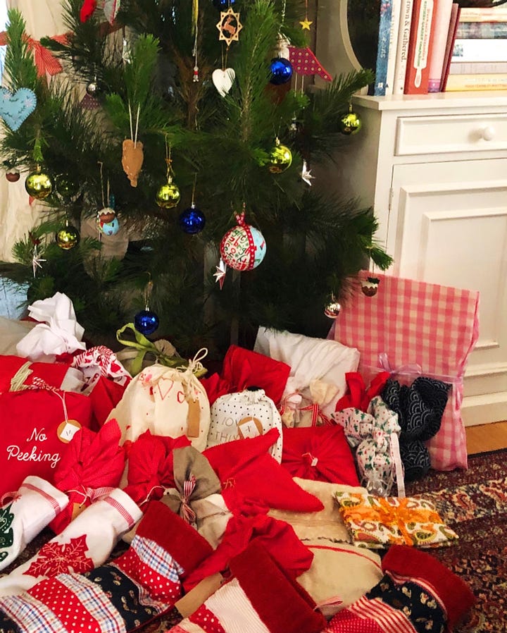 1. Christmas tree with cloth-wrapped gifts 2. Seasonal favourites for lunch 3. Paper hats and terrible jokes 4. Delicious homemade drinks and traditions we've made for ourselves. 