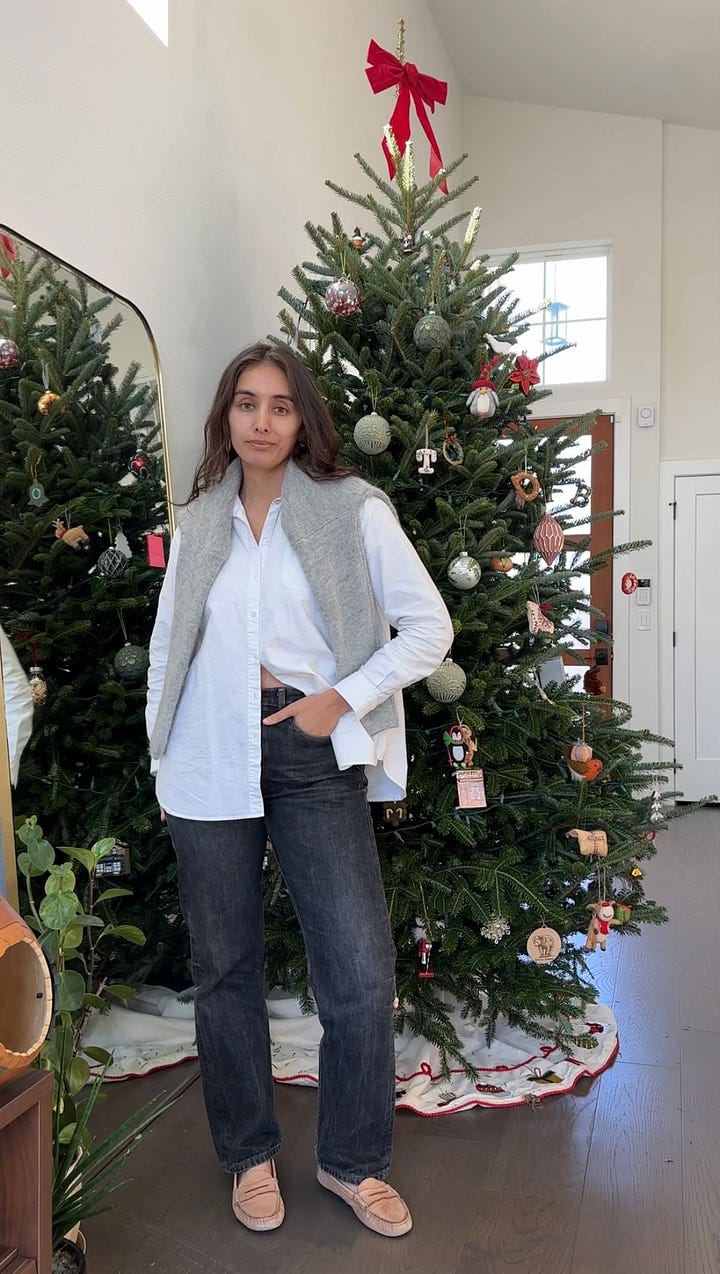 woman standing in white button down