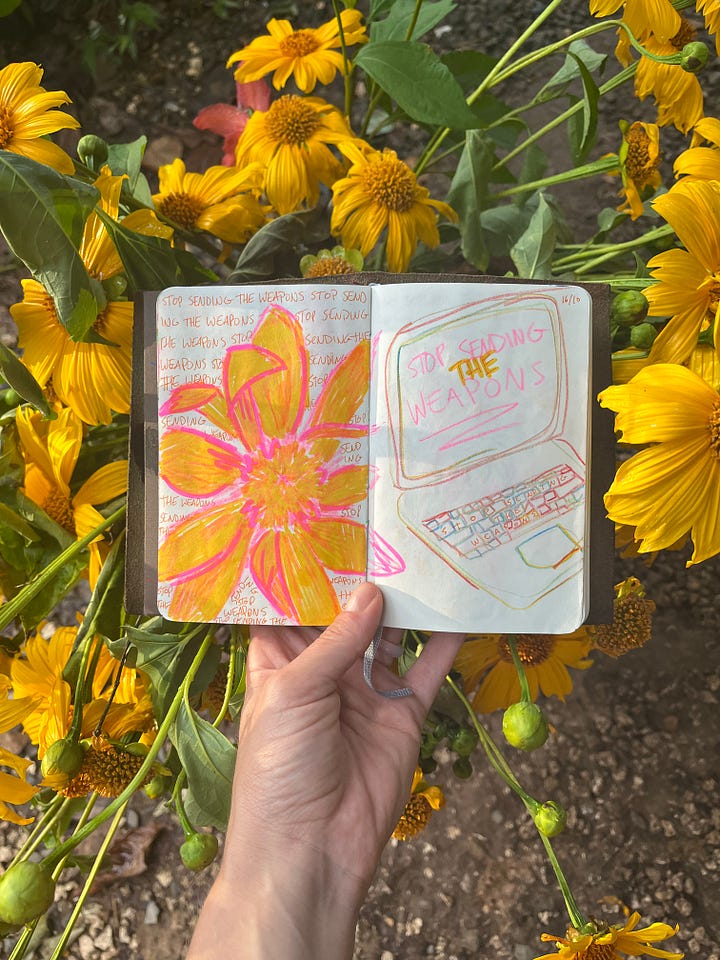 Mexican Sunflower is a bright yellow/orange color. Here, drawings of the flowers are photographed in front of the cut and arranged flowers.