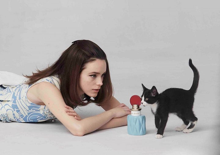 Miu Miu: L’Eau Bleue Eau de Parfum campaign and Famous Cats sweaters, both 2018