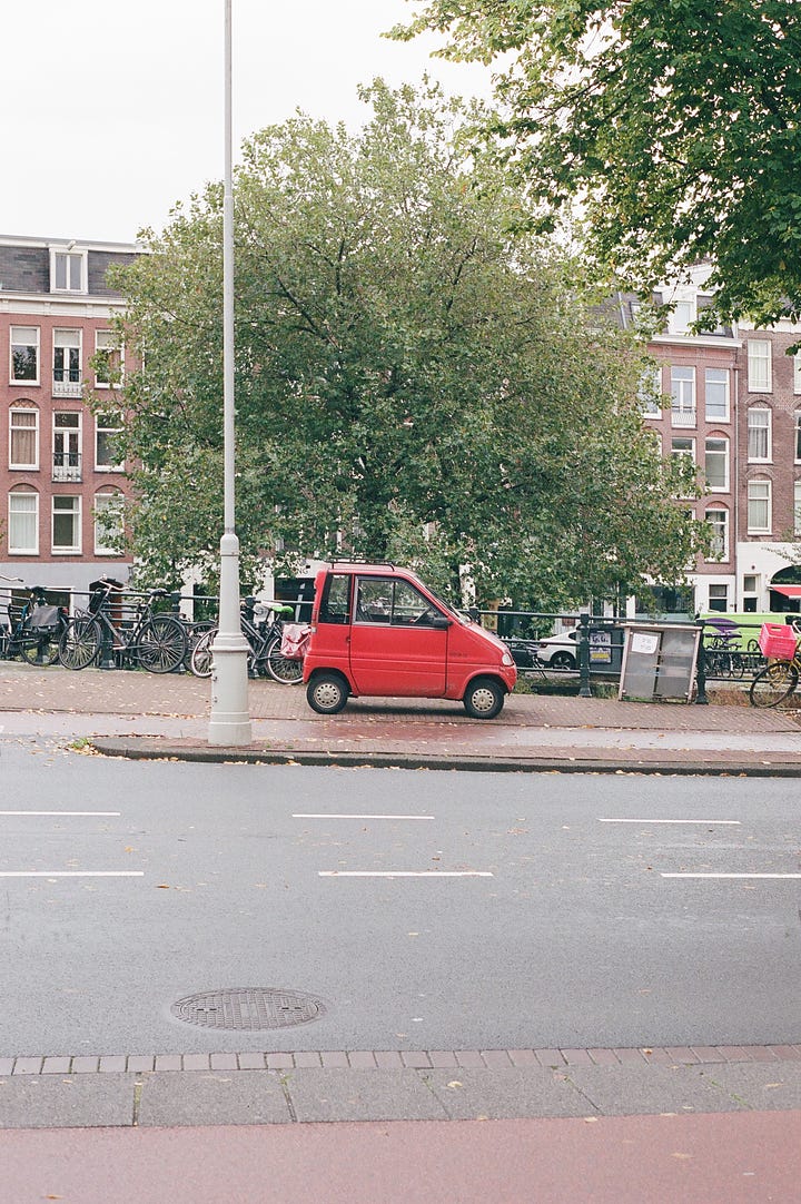 red mini car and bikes