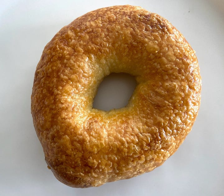 The tops of two bagels. 