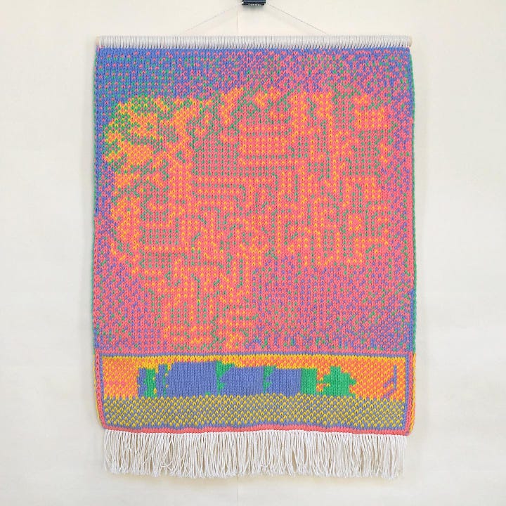 Two pieces of Katya Budkovskaya’s knitted art. The art is made out of pink, orange, blue, and green threads and knitted so that they sort of resemble digital, pixelated graphic art.