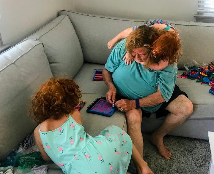 Grandma teaching kids how to weave potholders