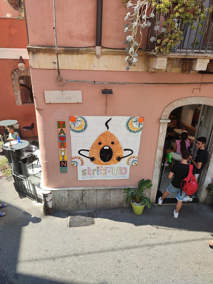 Cartoon Aranchine sign and Sicilian ceramics