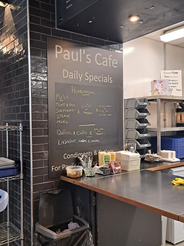 Barnsley Market; butcher counter, and Pauls Cafe menu