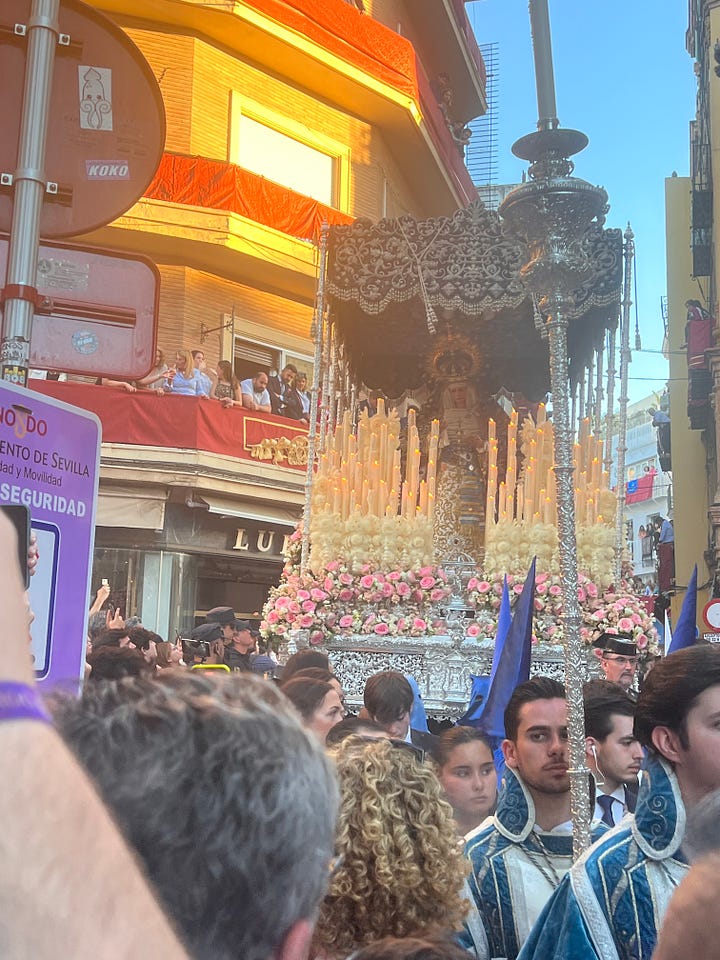 a gallery of pictures showing people in a crowded street as they watch the procession of a brotherhood carrying floats with decorations, flowers and statues