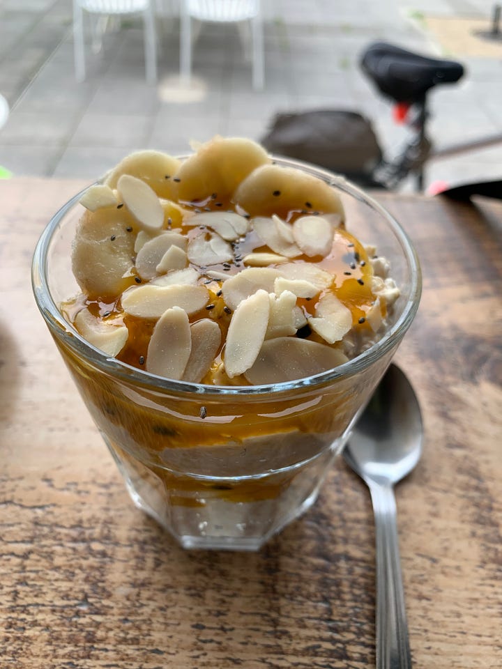 On the left, a picture of flat white with a heart latte art. On the right, overnight oats topped with sliced almond