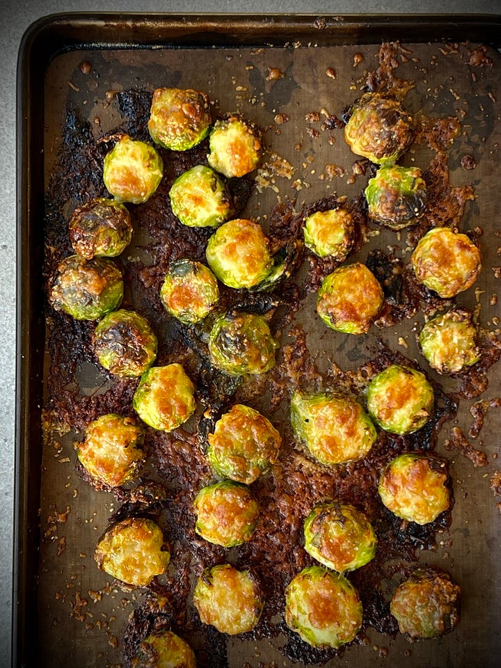 cheesy roast sprouts on a plate with celeriac dip