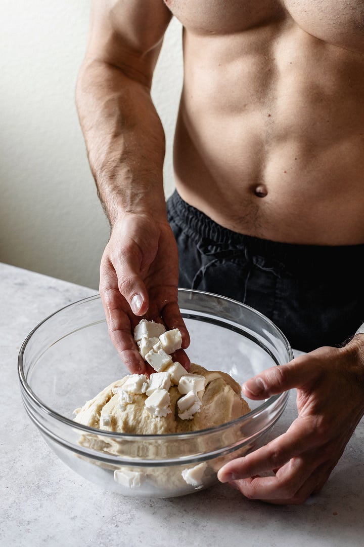 Shirtless man making vegan plant milk bread dough