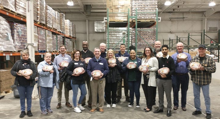 Giant Food's local management and human resources team visited the Fredericksburg Regional Food Bank last week to donate 200 Easter hams and help assemble boxes for distribution. Photos courtesy Fredericksburg Regional Food Bank. 