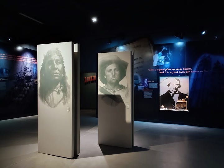 Room with panels showing large photos of Native, Black, and white people and lots of text. Panel showing Biddy Mason, who traveled fro the Deep South to Utah and then Los Angeles, as a slave. She sued and won her freedom in LA. Image: Annette Laing, 2024