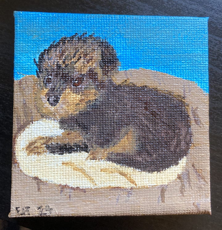 A painting of a tiny Yorkshire terrier puppy on a tiny canvas and a photo of the same tiny Yorkshire terrier.