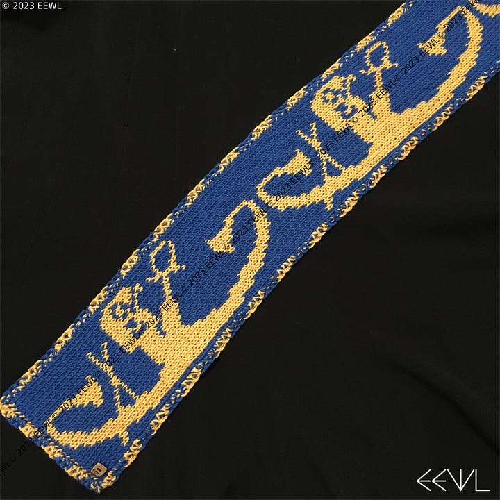 Images of both sides of a blue and yellow hand-knitted scarf. The pattern on the scarf features the Ancient Egyptian sun god Ra traveling across the sky in his solar barque, or boat.