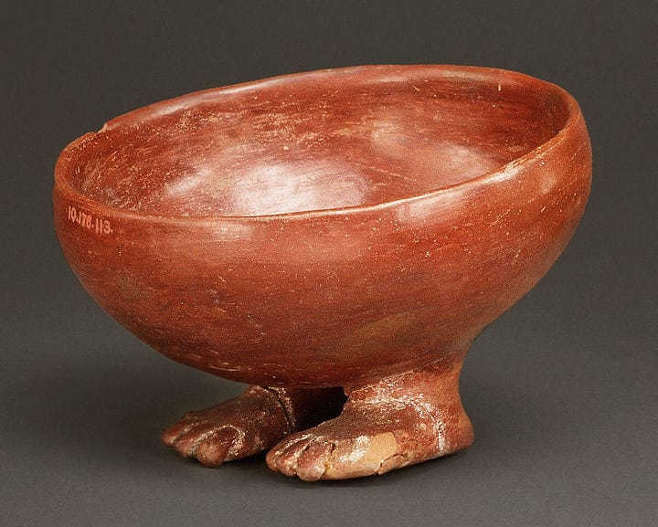 Glazed terracotta bowl with little human feet as the base 