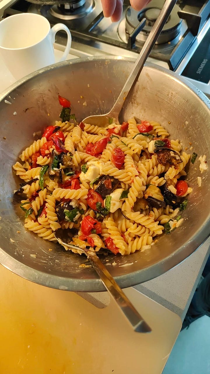 Roasted Eggplant and Tomato fabulousness fusilli basil red pepper in a bowl with a spoon