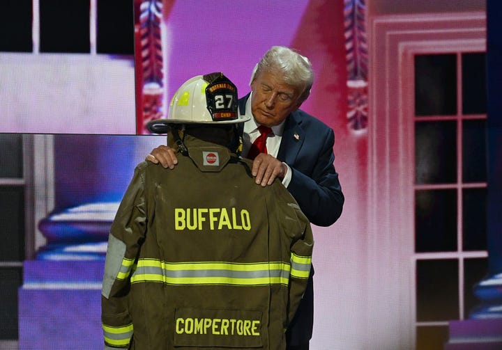 Trump on stage behind his name in lights. Trump embraced the uniform of a firefighter who died during an assassination attempt on Trump’s life at a political rally.