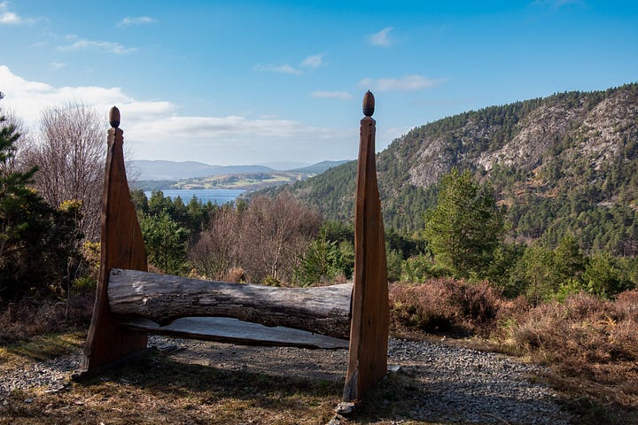 Migdale rock and loch from the shore and a bench above, the Spinningdale viewpoint and a red squirrel carving on a seat © Felicity Martin