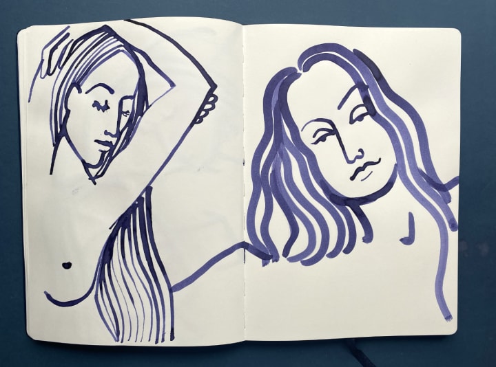 Images of female figure and portrait drawn in blue ink in open sketch book pages