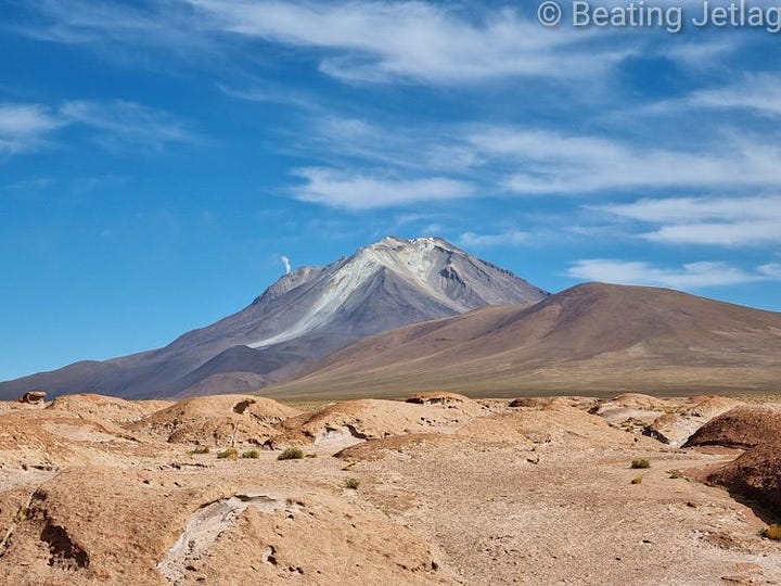 Views of Salar de Uyuni and a volcano in the desert in Bolivia
