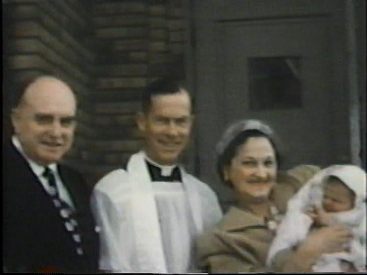 Two couples, a priest, and a baby