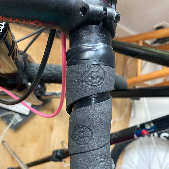 picture of handlebar tape, unravelling from the bars